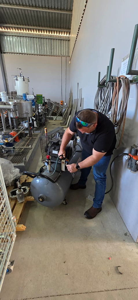 Jaco working on a compressor