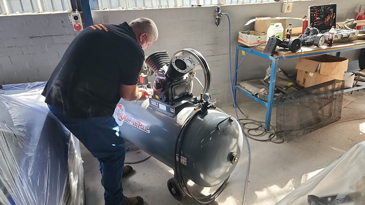 Chris working on a compressor