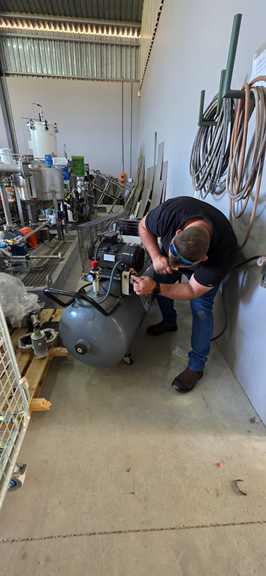 Jaco maintaining a compressor