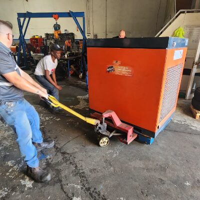Equipment being loaded off at workshop